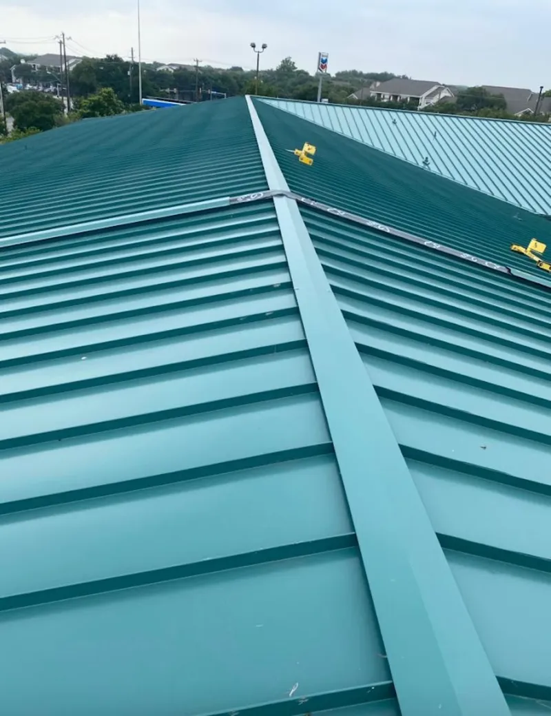 Green commercial metal roof ridge and valley for Metal Roof Repair in Crete